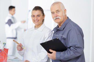 portrait of female apprentice decorator and her tutor