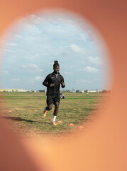 man running on the soccer field practicing