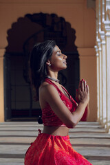 Yogini dancing and practicing yoga near a palace in Mysore, India. Mindful yoga practice....