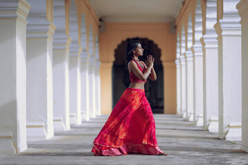 Yogini dancing and practicing yoga near a palace in Mysore, India. Mindful yoga practice. Improvisation. Contemporary dance.