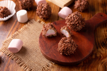 Homemade Caramel Marshmallows covered in chocolate flavor puffed rice, sweet treat easy to make, no baking required, ideal for parties and festivities, Christmas favorites.