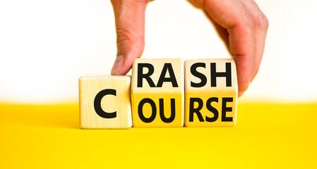 Crash course symbol. Concept words Crash course on wooden cubes. Beautiful yellow table white...