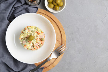 Ensaladilla Rusa in a white plate.Top view. Traditional Spanish food is tapas. Selective focus. Copy Space