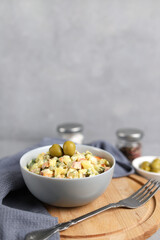 Ensaladilla Rusa in a gray plate. Traditional Spanish food is tapas. Selective focus. Vertical photo, copy space