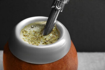 Calabash with mate tea and bombilla, closeup