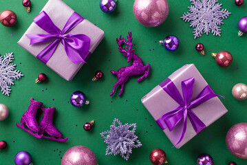New Year concept. Top view photo of lilac present boxes with violet bows pink purple baubles reindeer flower snowflake ice skates ornaments and sequins on isolated green background