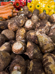 Fresh yams in the supermarket. Vegetables and fruits exposed for the consumer to choose