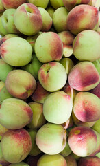 Fresh peach in the supermarket. Vegetables and fruits exposed for the consumer to choose. Top view.