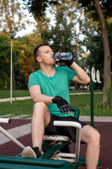 Refreshment during a training in outdoor gym