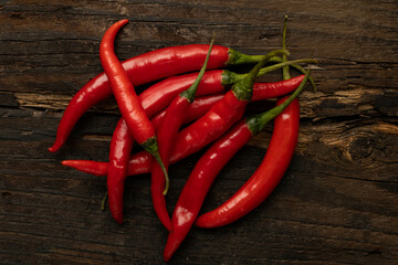 Red hot pepper on a wooden table.