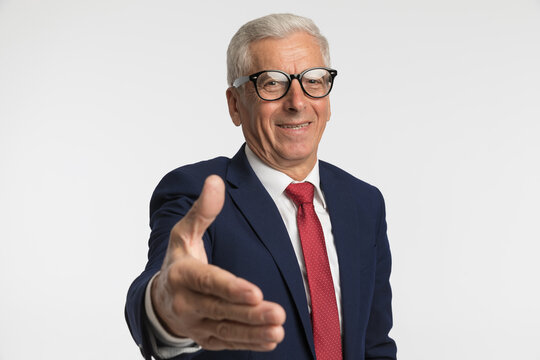 Businessman extending his arm to shake hands, being friendly - Powered by Adobe