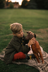 Boy in a park with a lama toy © Myroslava