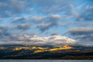Cloudy and Snowy Fall Sunrise over Colorado Mountains, wide shot of Mt Elbert