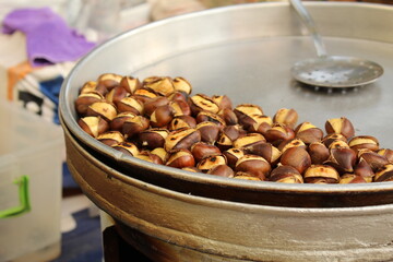Fresh roasted chestnut on a roasting stall
