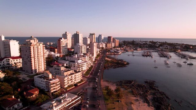 Aerial view on coastal city in Punta Del Este, Uruguay on sunset. High quality 4k drone footage