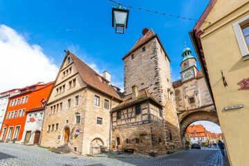 Fototapeta na wymiar View of the Röder-Arch and St Mark's Tower in the medieval old town of Rothenburg ob der Tauber, Germany.
