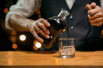 Barman pouring whiskey whiskey glass beautiful night