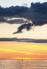 Naklejka premium Mid-summer Scottish sunset and distant paddle boarder,the Bay at Balnakeil Beach,Lairg,northwest tip of Scotland,UK.