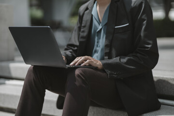 Employees fired or resigned from the company use laptop to find a job, schedule an interview..Unemployed, hiring job, quitting job concept.