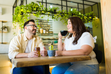 Beautiful couple having a fun date at the coffee shop