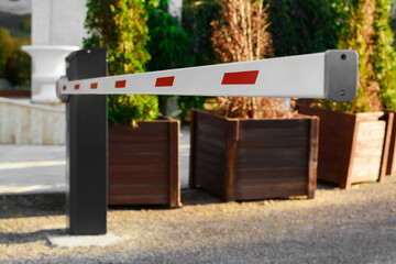 Closed boom barrier on sunny day outdoors, closeup © New Africa