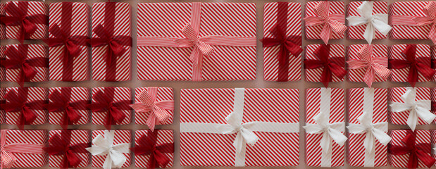 Christmas Presents Precisely arranged in a Grid. Elegant Red and White Festive Wallpaper.