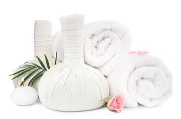 Fototapeta na wymiar Herbal massage bags and towels on white background. Spa supply