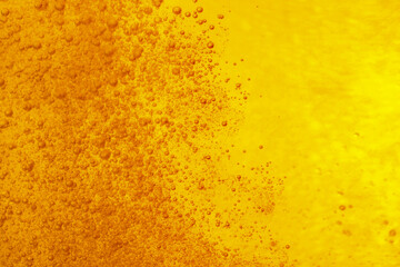 Tasty beer with bubbles as background, closeup