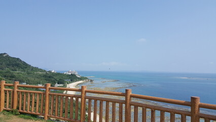 Okinawa, Japan. View from Cape Chinen Park. Horizontal and clam ocean with green nature.