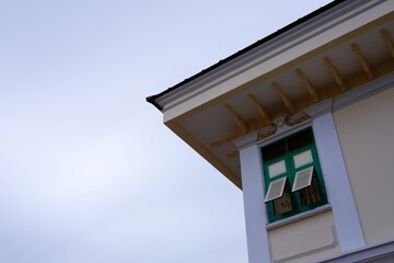 Vintage Thai Tradition Window and Roof with White Cloud and Blue Sky.