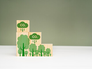 Net-Zero carbon emissions by 2050. Wooden cubes with CO2 and green tree icons