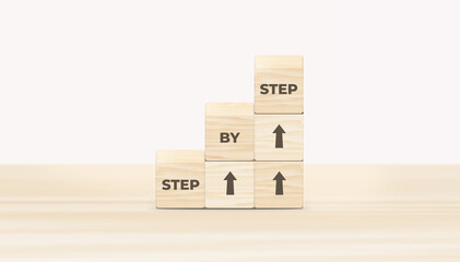 The word step by step on wooden cubes. Achievement or progress in business career. 3D illustration.