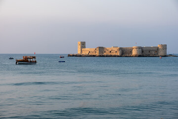 Kizkalesi or Maiden Castle near Mersin on a small island at sunrise