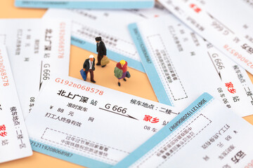 Fototapeta na wymiar Miniature Photography Train Tickets and Passengers Home