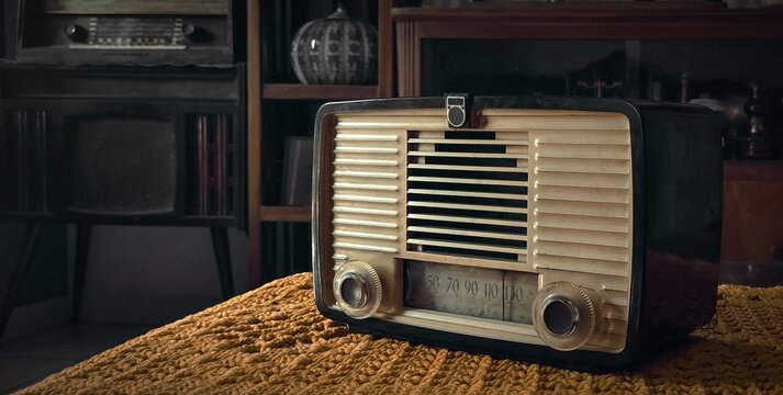 old tube radio on tablecloth vintage stuff background