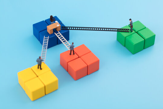 Miniature scene: three people competing for one post