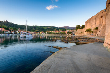 Collioure harbor and medieval castle at sunrise in France