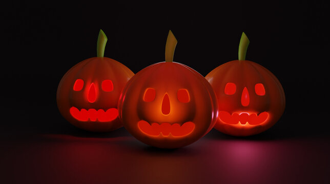 Halloween pumpkin smile and scrary eyes for party night. Close up view of scary with eyes glowing inside at black background. Selective focus. Illuminated cute pumpkin isolated on black background