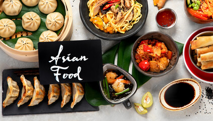 Assorted Chinese food on dark background. Asian food concept. Top view.