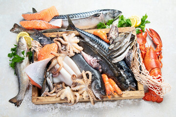 Fresh fish and seafood arrangement. Healthy eating concept. Top view..