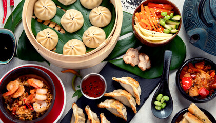 Assorted Chinese food on dark background. Asian food concept. Top view.