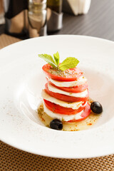 Caprese Salad on whtie plate