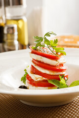 Caprese Salad on whtie plate