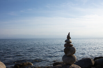 Pyramid from coastal stones combined by the local master - the amateur
