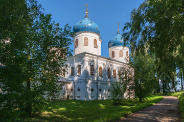 Fototapeta na wymiar View of the Cross Exaltation Cathedral of St. George (Yuryev) Monastery on a sunny summer day, Veliky Novgorod, Russia