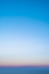 Vertical shot of smooth gradient blue background.