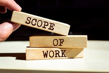 Wooden blocks with words 'Scope of work'. Business concept