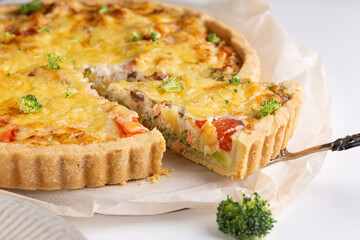 Traditional homemade pie with salmon fish and broccoli