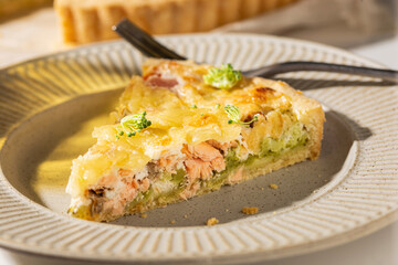 Dinner with fresh homemade pie with salmon fish and broccoli, quiche