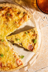 Freshly baked quiche with salmon and broccoli